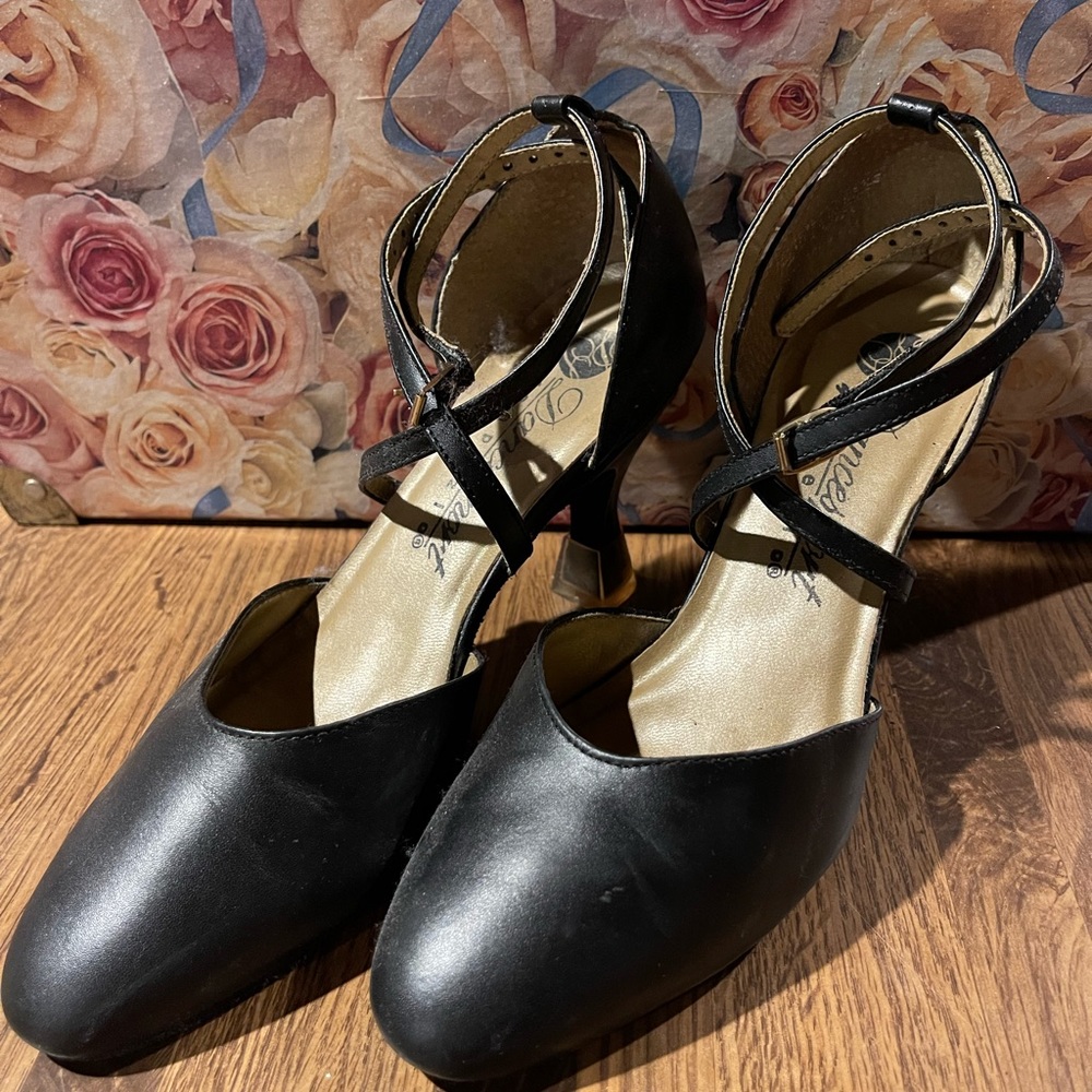 Black ballet ankle heel size 6 worn by professional ballroom dancer